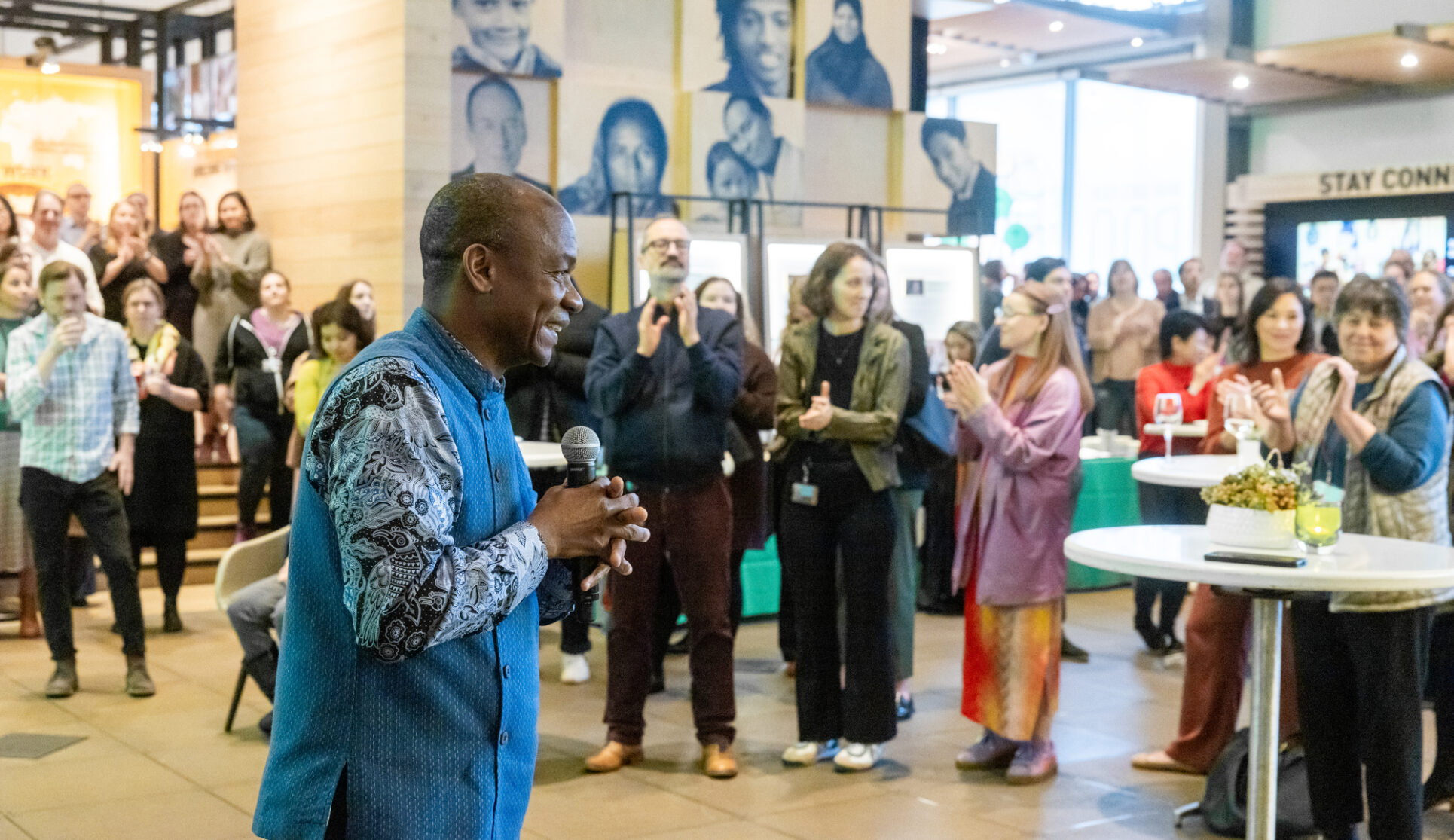 Doulaye Kone speaks to a crowd of guests at the Discovery Center.