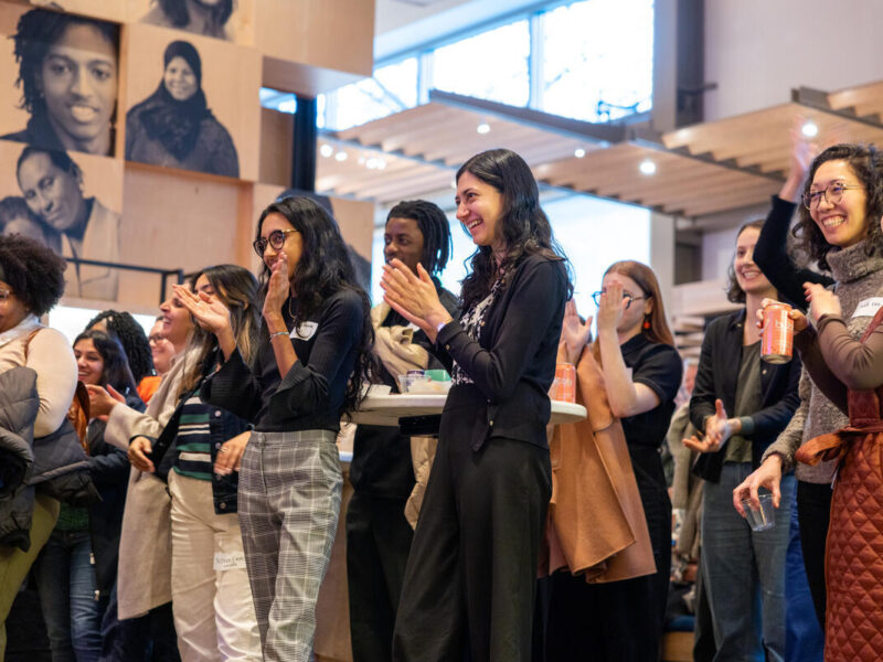 Guests applaud during and event at the Gates Foundation Discovery Center.