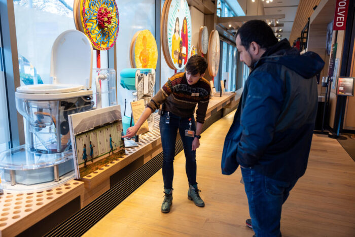 Tour guide points our objects to guests in the Discovery Center