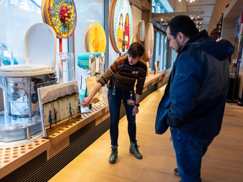 Tour guide points our objects to guests in the Discovery Center